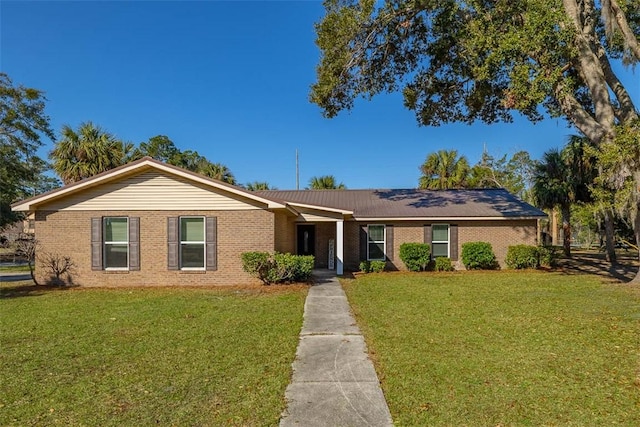 single story home featuring a front lawn