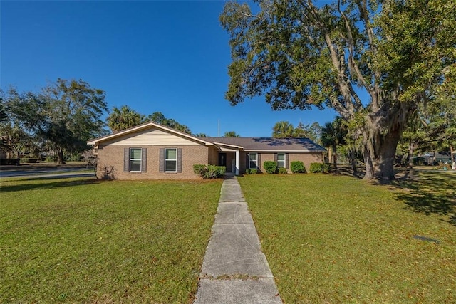 ranch-style home featuring a front yard