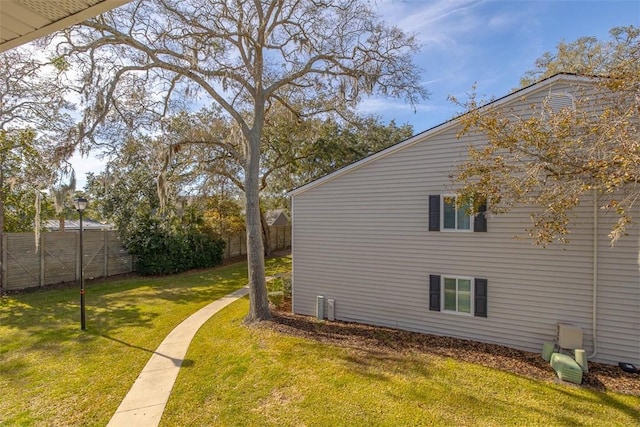 view of side of property with a yard