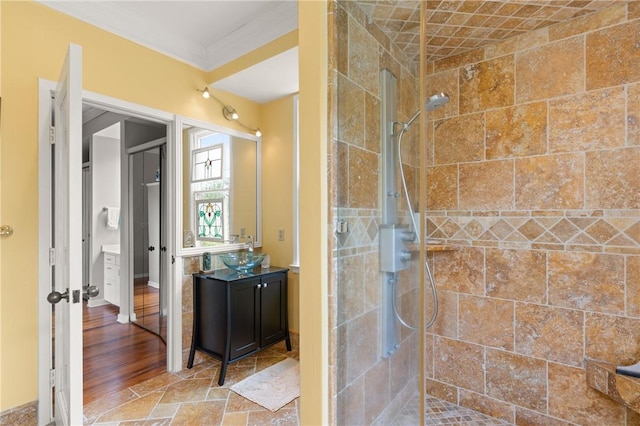 207 Military Rd, Saint Simons Island, GA 31522 - full bath with tiled shower, vanity, and crown molding