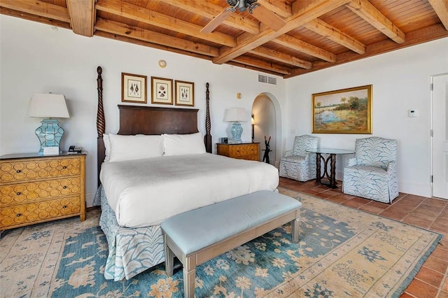 tiled bedroom with beamed ceiling and wood ceiling