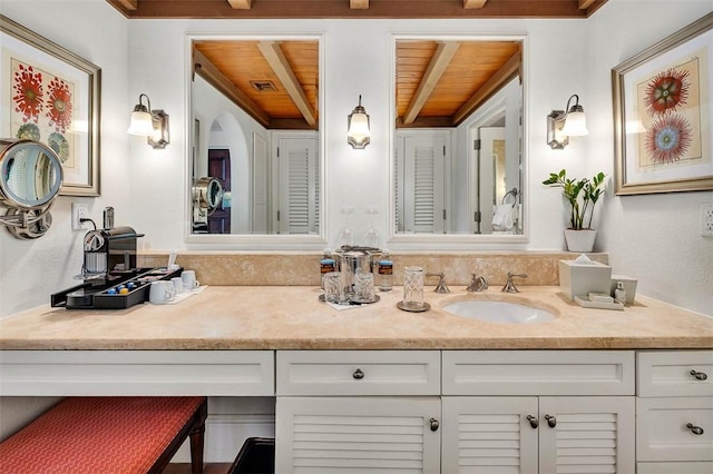 bathroom with vanity and wooden ceiling