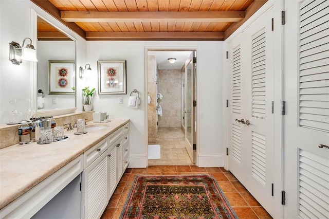 bathroom with beam ceiling, vanity, and wooden ceiling