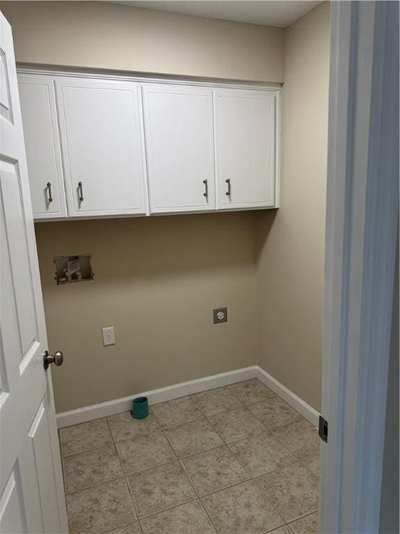 clothes washing area featuring electric dryer hookup, hookup for a washing machine, and cabinets