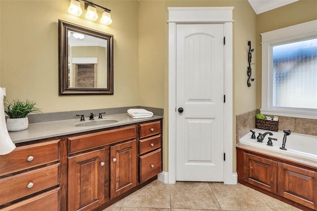 bathroom featuring tile patterned flooring, vanity, and a washtub