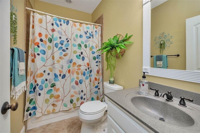 full bathroom featuring shower / tub combo, tile patterned floors, vanity, a textured ceiling, and toilet