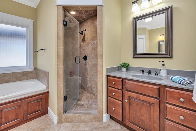 bathroom featuring plus walk in shower, vanity, tile patterned floors, and crown molding