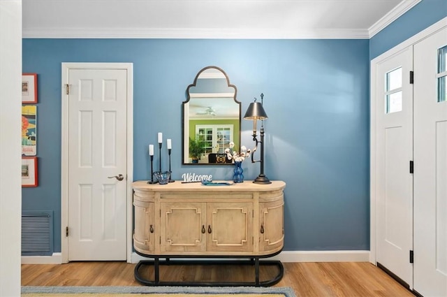 552 Old Plantation Rd, Jekyll Island, GA 31527 - bathroom featuring wood finished floors and ornamental molding