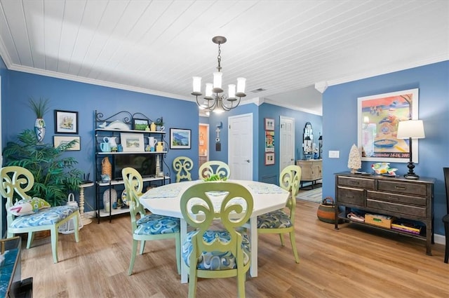552 Old Plantation Rd, Jekyll Island, GA 31527 - dining area featuring a chandelier, ornamental molding, wood finished floors, and wooden ceiling
