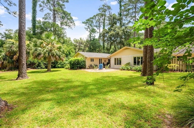 552 Old Plantation Rd, Jekyll Island, GA 31527 - view of grassy yard with a patio