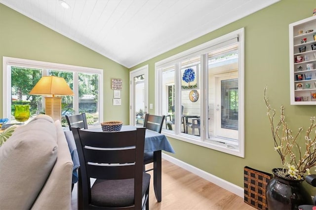 552 Old Plantation Rd, Jekyll Island, GA 31527 - dining space with vaulted ceiling and wood finished floors