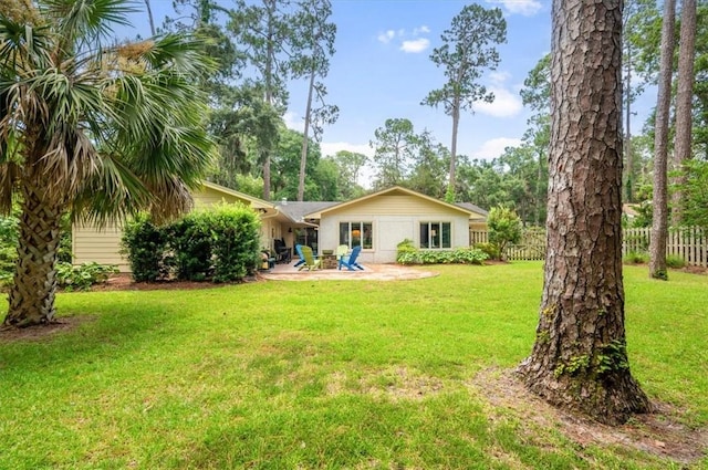 552 Old Plantation Rd, Jekyll Island, GA 31527 - rear view of house with a patio area