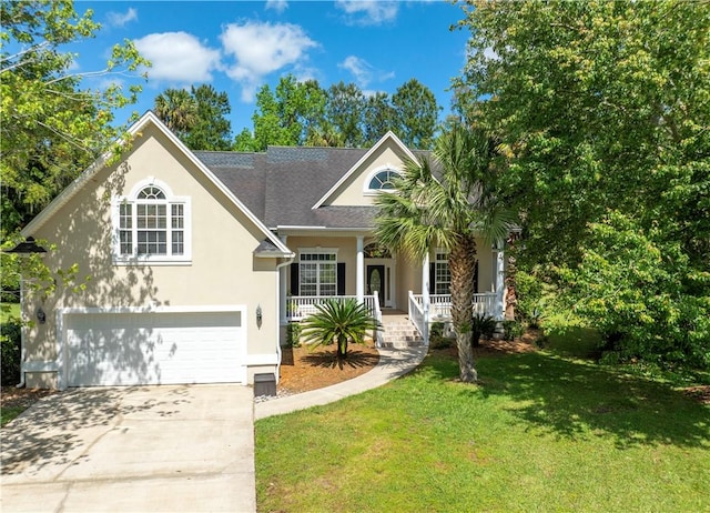 108 Northwind Dr, Brunswick, GA 31523 - view of front of house with a front yard, a porch, a garage, concrete driveway, and stucco siding