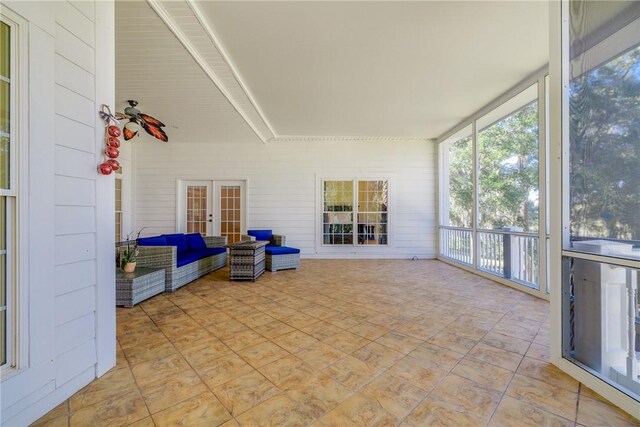 unfurnished sunroom with french doors