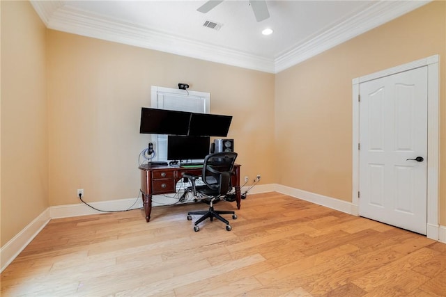 office space featuring ceiling fan, ornamental molding, and light hardwood / wood-style flooring