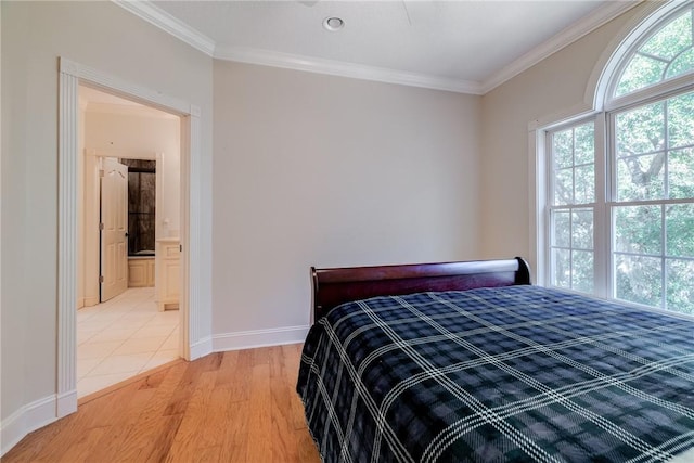 bedroom with ornamental molding and light hardwood / wood-style flooring