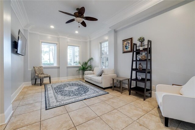 living area with light tile patterned floors, ornamental molding, and ceiling fan