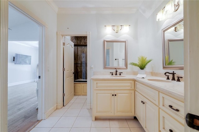 bathroom with vanity, tile patterned floors, ornamental molding, and walk in shower