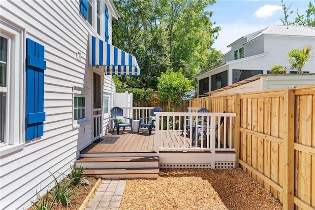 405 Everett St, Saint Simons Island, GA 31522 - wooden terrace featuring a fenced backyard
