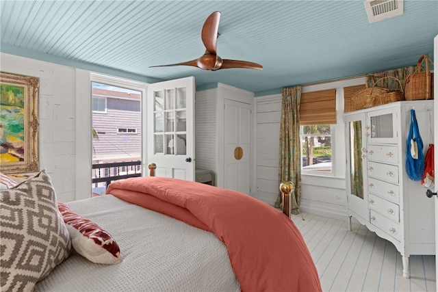 405 Everett St, Saint Simons Island, GA 31522 - bedroom with multiple windows, ceiling fan, and wood finished floors