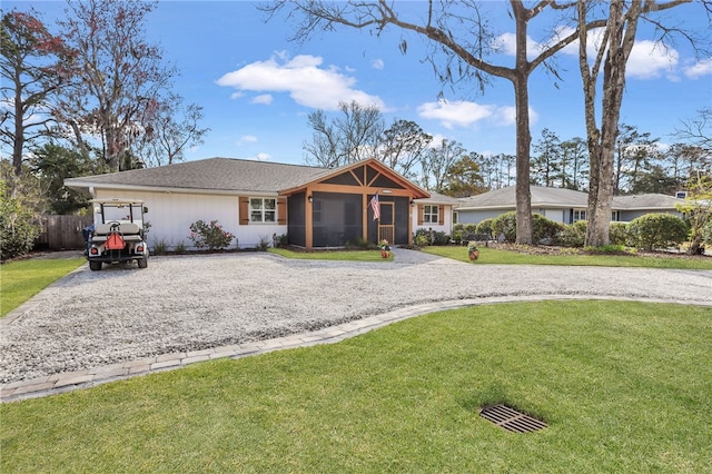 246 Alabama St, Saint Simons Island, GA 31522 - ranch-style house featuring a sunroom and gravel driveway