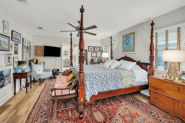246 Alabama St, Saint Simons Island, GA 31522 - bedroom featuring light wood-style floors, multiple windows, ceiling fan, and baseboards