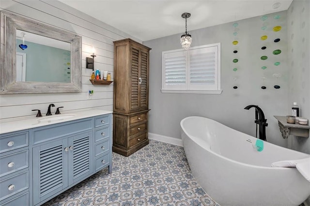 246 Alabama St, Saint Simons Island, GA 31522 - full bath featuring vanity, a freestanding bath, and baseboards