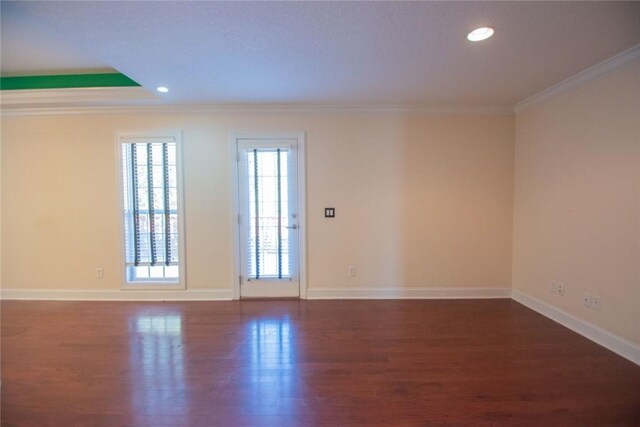 bedroom with crown molding and dark hardwood / wood-style flooring