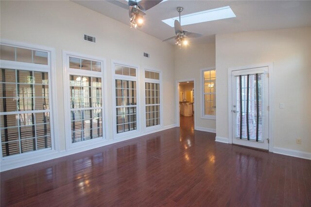 living room with hardwood / wood-style flooring, crown molding, ceiling fan, and a fireplace