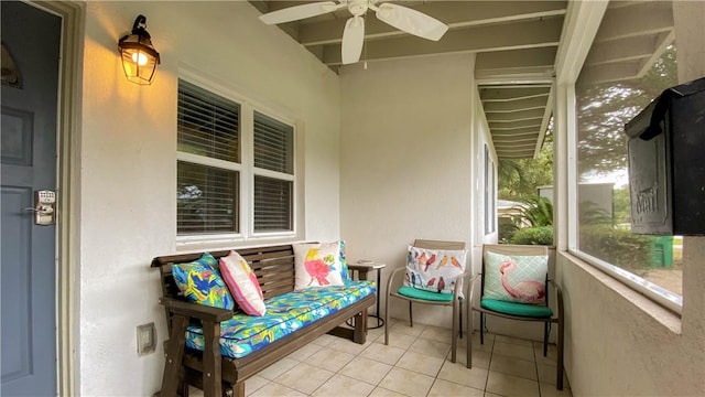 sunroom featuring ceiling fan