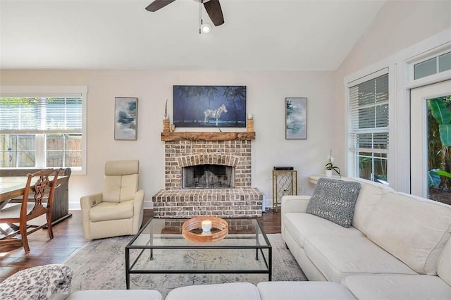 107 Reynoso Ave, Saint Simons Island, GA 31522 - living area with wood finished floors, a ceiling fan, baseboards, a fireplace, and vaulted ceiling