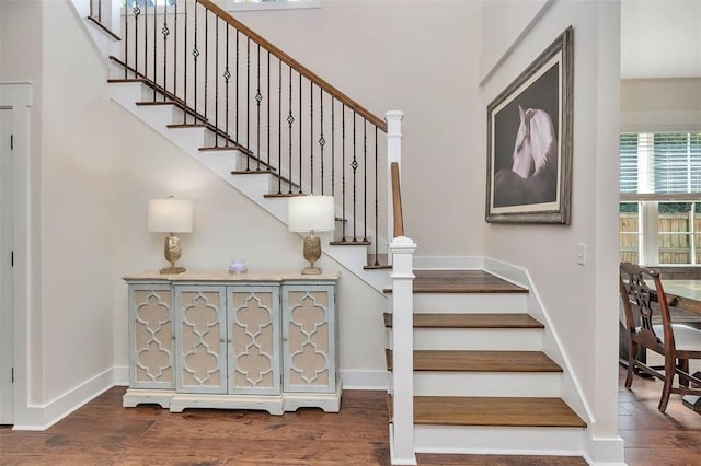 107 Reynoso Ave, Saint Simons Island, GA 31522 - stairs featuring wood finished floors and baseboards