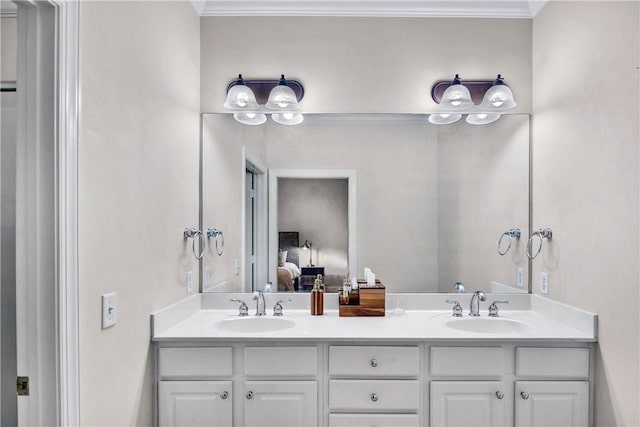 bathroom with vanity and ornamental molding