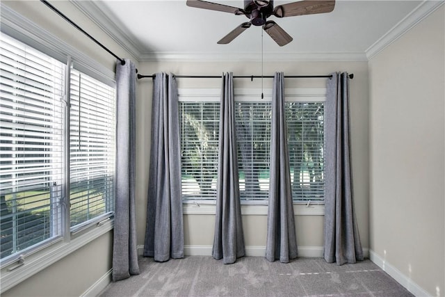 unfurnished room with light carpet, ceiling fan, and ornamental molding