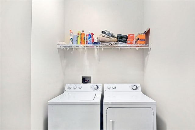 laundry area with separate washer and dryer