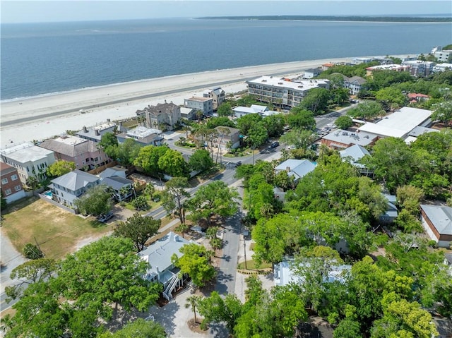 birds eye view of property with a water view and a view of the beach