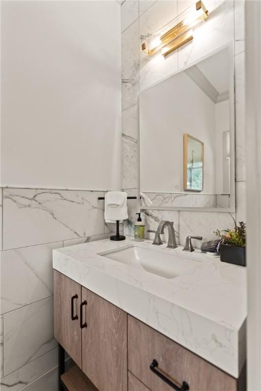 bathroom with tile walls and vanity
