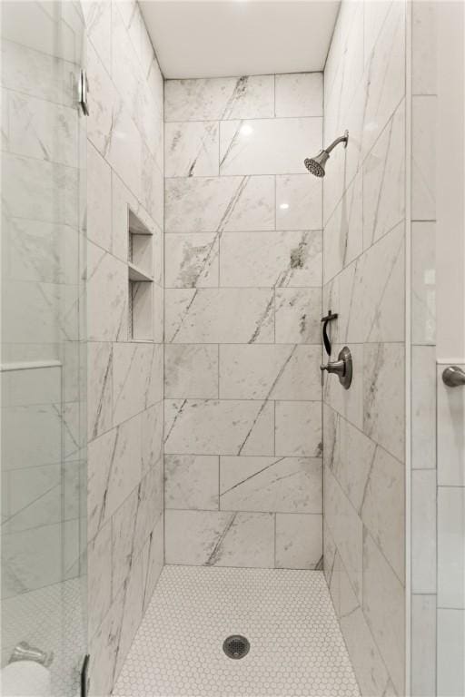 full bath featuring a shower stall