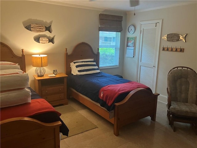 635 Old Plantation Rd, Jekyll Island, GA 31527 - bedroom with a closet, light tile patterned floors, and ornamental molding