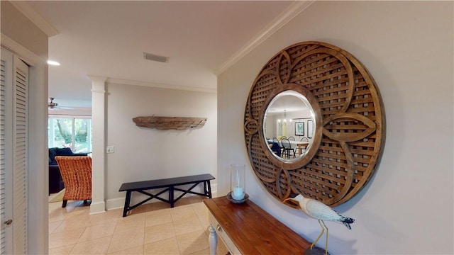 635 Old Plantation Rd, Jekyll Island, GA 31527 - hall with baseboards, ornamental molding, visible vents, and light tile patterned flooring