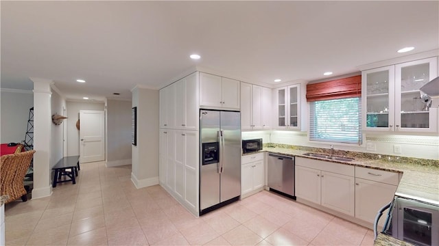 635 Old Plantation Rd, Jekyll Island, GA 31527 - kitchen featuring a sink, stainless steel appliances, white cabinetry, light stone counters, and recessed lighting