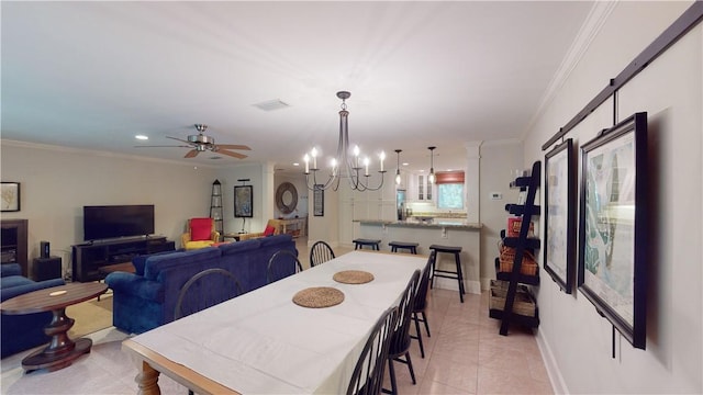635 Old Plantation Rd, Jekyll Island, GA 31527 - dining room with recessed lighting, ornamental molding, visible vents, light tile patterned flooring, and ceiling fan with notable chandelier