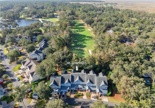 bird's eye view with a residential view, golf course view, a water view, and a wooded view