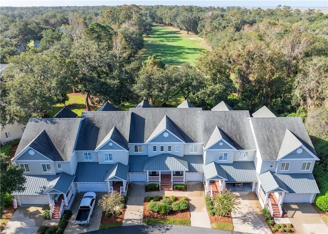 aerial view featuring a wooded view