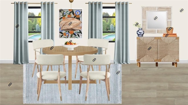 dining room with baseboards, plenty of natural light, and wood finished floors