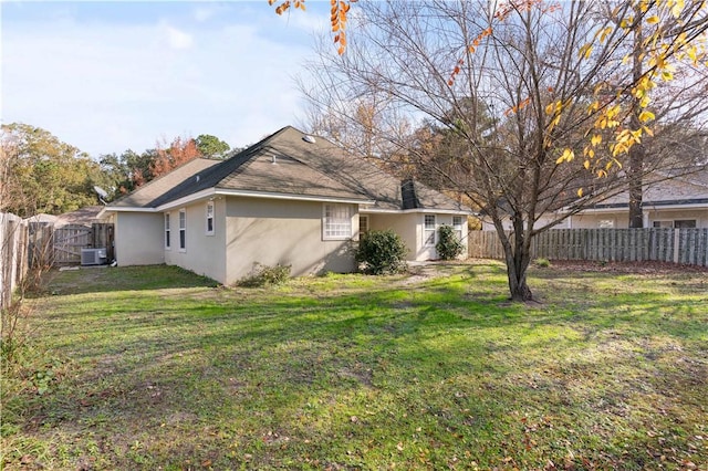 view of property exterior featuring a yard and central air condition unit