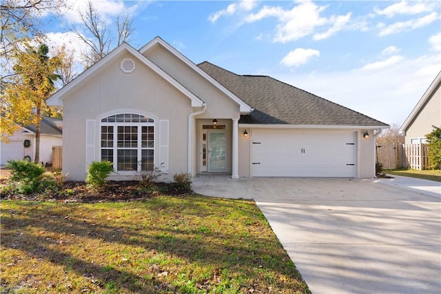 ranch-style home featuring a front lawn and a garage