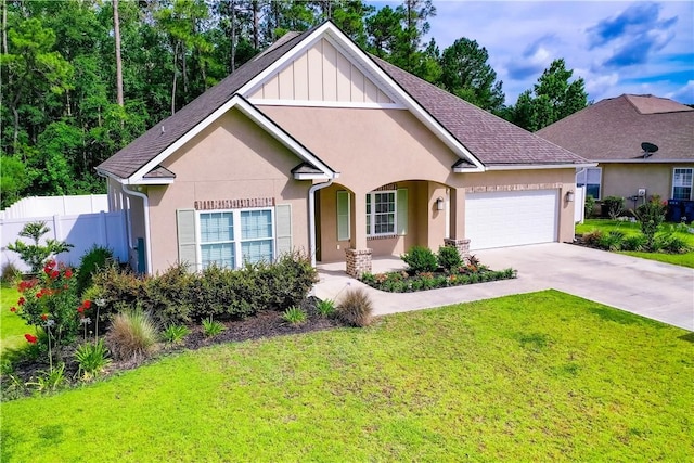 view of front of house with a garage and a front yard