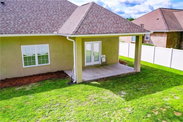 550 Freedom Trl, Brunswick, GA 31525 - rear view of property featuring a yard, a patio, and french doors