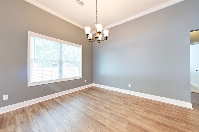 550 Freedom Trl, Brunswick, GA 31525 - empty room with light hardwood / wood-style floors, ornamental molding, and a chandelier